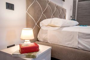 Posteľ alebo postele v izbe v ubytovaní LA DOLCE VITA ROOMS
