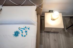 Posteľ alebo postele v izbe v ubytovaní LA DOLCE VITA ROOMS