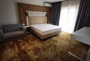 Postel nebo postele na pokoji v ubytování Pensiunea Palace