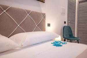 Posteľ alebo postele v izbe v ubytovaní LA DOLCE VITA ROOMS