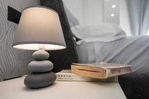 Posteľ alebo postele v izbe v ubytovaní LA DOLCE VITA ROOMS