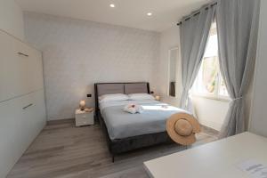 Posteľ alebo postele v izbe v ubytovaní LA DOLCE VITA ROOMS