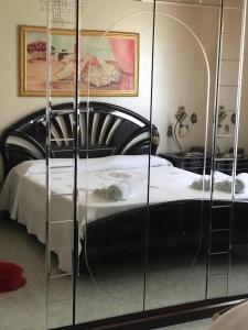 Posteľ alebo postele v izbe v ubytovaní Casa Vacanza Nonna Adri + 37 fotografií