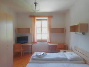 Letto o letti in una camera di Gasthof Elisabeth