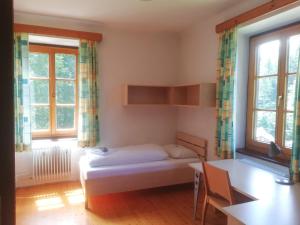 Letto o letti in una camera di Gasthof Elisabeth