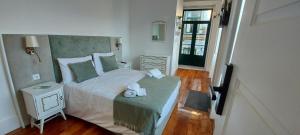 Ένα ή περισσότερα κρεβάτια σε δωμάτιο στο A Portuguesa Guest House
