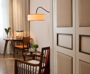 a door to a room with a table and chairs at The Norman Tel Aviv in Tel Aviv