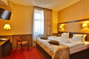 Posteľ alebo postele v izbe v ubytovaní Hotel Wielopole