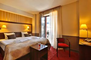 Posteľ alebo postele v izbe v ubytovaní Hotel Wielopole