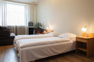 Postel nebo postele na pokoji v ubytování Guesthouse Jakob Lenz