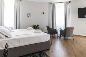 Postel nebo postele na pokoji v ubytování Dolac apartments