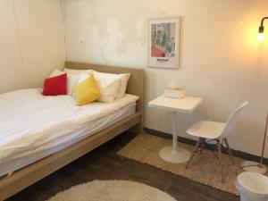 Säng eller sängar i ett rum på Hostel Seoul
