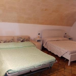 Postel nebo postele na pokoji v ubytování Bed And Breakfast Nelmuro