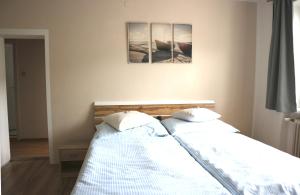 A bed or beds in a room at Apartments Obdach