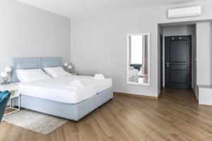 Postel nebo postele na pokoji v ubytování Dolac apartments