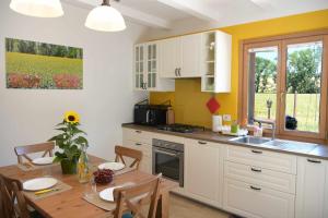 A kitchen or kitchenette at Casa Montefiore 13 LT nella tranquilla campagna Marchigiana
