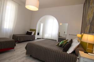 Voodi või voodid majutusasutuse B&B 7 Rooms toas