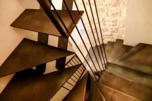 a metal spiral staircase in a building at BAYIT Charming Place in Polignano a Mare