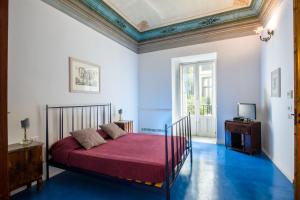 Postel nebo postele na pokoji v ubytování Nuvole Residenza by Wonderful Italy