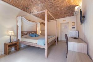 Letto o letti in una camera di Hotel Al Convento