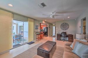 a living room with a couch and a ceiling fan at Naples Paradise with Private Pool, 4 Mi to Beach! in Naples