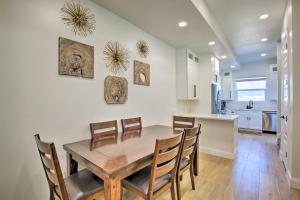 a kitchen and dining room with a wooden table and chairs at Modern Mtn View Townhome Less Than 5 Mi to Skiing! in Eden