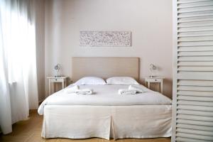 Postel nebo postele na pokoji v ubytování Serenity Luxury Villa, Skiathos