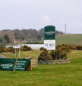 a sign that reads the mill in a field at Tummel 2 in Forfar