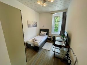 Postel nebo postele na pokoji v ubytování Waldhaus Pulsnitz