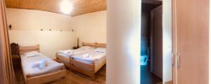 Katil atau katil-katil dalam bilik di Guesthouse and Cottage Nicolo