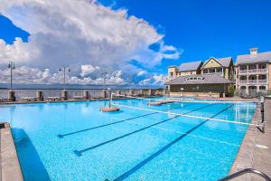 a large swimming pool in front of a hotel at Sunset Island - 22 Island Edge in Ocean City