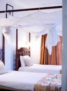 Voodi või voodid majutusasutuse The Ad Lib Executive lodge toas