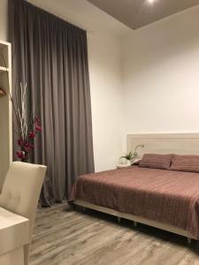 Postel nebo postele na pokoji v ubytování B&B LEI