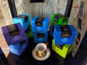 a table topped with blue and green coffee bags at Antica Taverna del Principe in Sepino