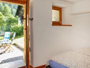 Postel nebo postele na pokoji v ubytování Holiday Home Rustico Enrico by Interhome