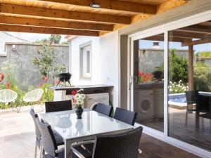 a patio with a table and chairs on a patio at Holiday Home Jorge by Interhome in Zamorano