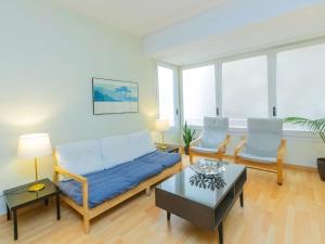 a living room with a couch and two chairs at Apartment Eixample Dret Corsega Roger Lluria by Interhome in Barcelona