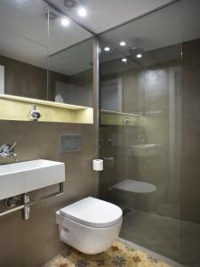 a bathroom with a toilet and a sink and a shower at Best House Best Place in Barcelona +56 photos