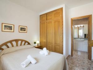 Łóżko lub łóżka w pokoju w obiekcie Villa Gardenia by Interhome