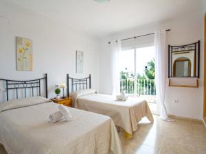 En eller flere senge i et værelse på Villa Nadaltenis by Interhome