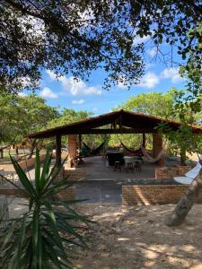 a pavilion with a picnic table in a park at Pousada do Rancho in Barreirinhas