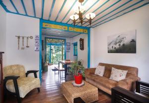 a living room with a couch and a table at Real House Salento in Salento