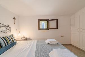 A bed or beds in a room at Seafront House in Andros Town by Explore Andros