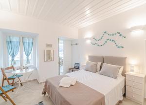 A bed or beds in a room at Seafront House in Andros Town by Explore Andros