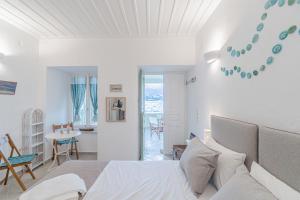 A bed or beds in a room at Seafront House in Andros Town by Explore Andros
