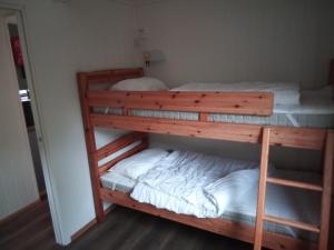 a couple of bunk beds in a room at Stenvåg Camping in Eidsdal