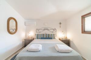 A bed or beds in a room at Seafront House in Andros Town by Explore Andros