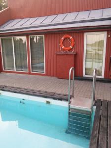 a chair sitting on the side of a swimming pool at Paatsalu Sadam in Paatsalu