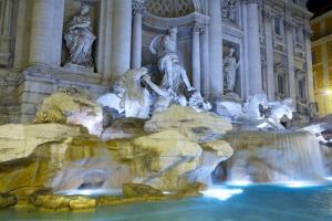 a fountain in front of a building with statues at Bella Roma - EE in Rome