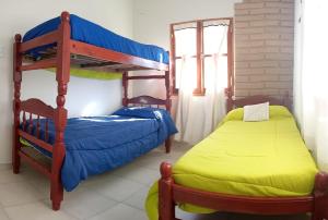 a bedroom with two bunk beds in a room at cabaña merlot in Cafayate